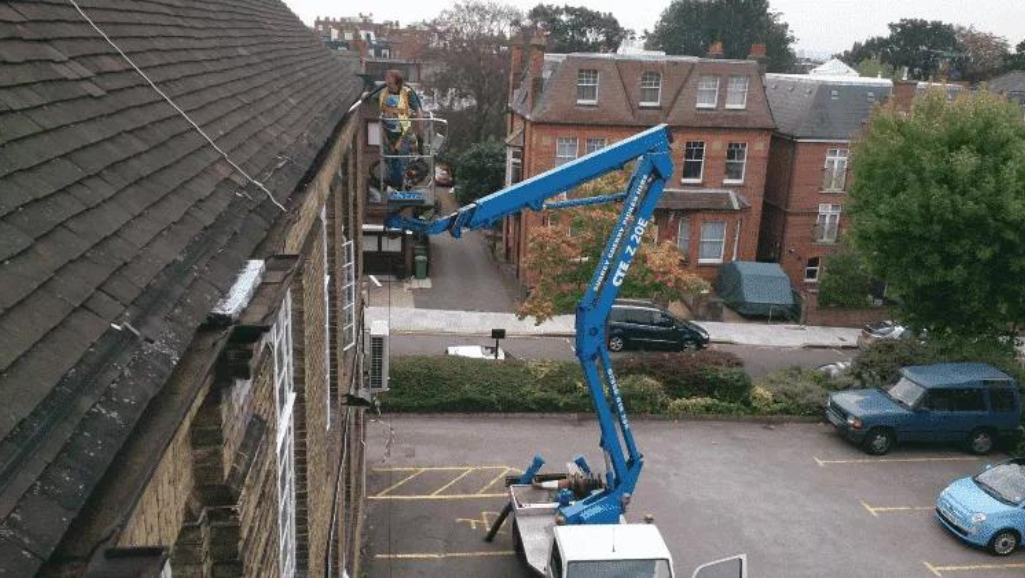 Cherry picker in use for commercial cleaning